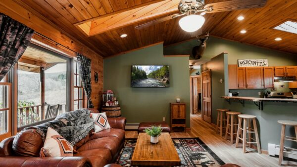 a living room filled with furniture and a flat screen tv